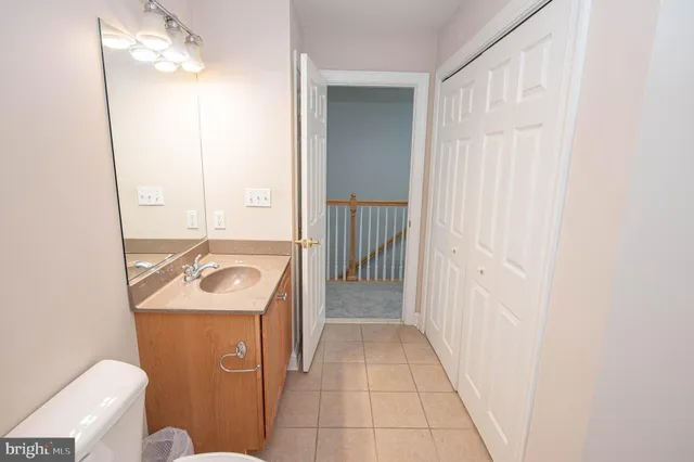 a street sign that is on a sidewalk