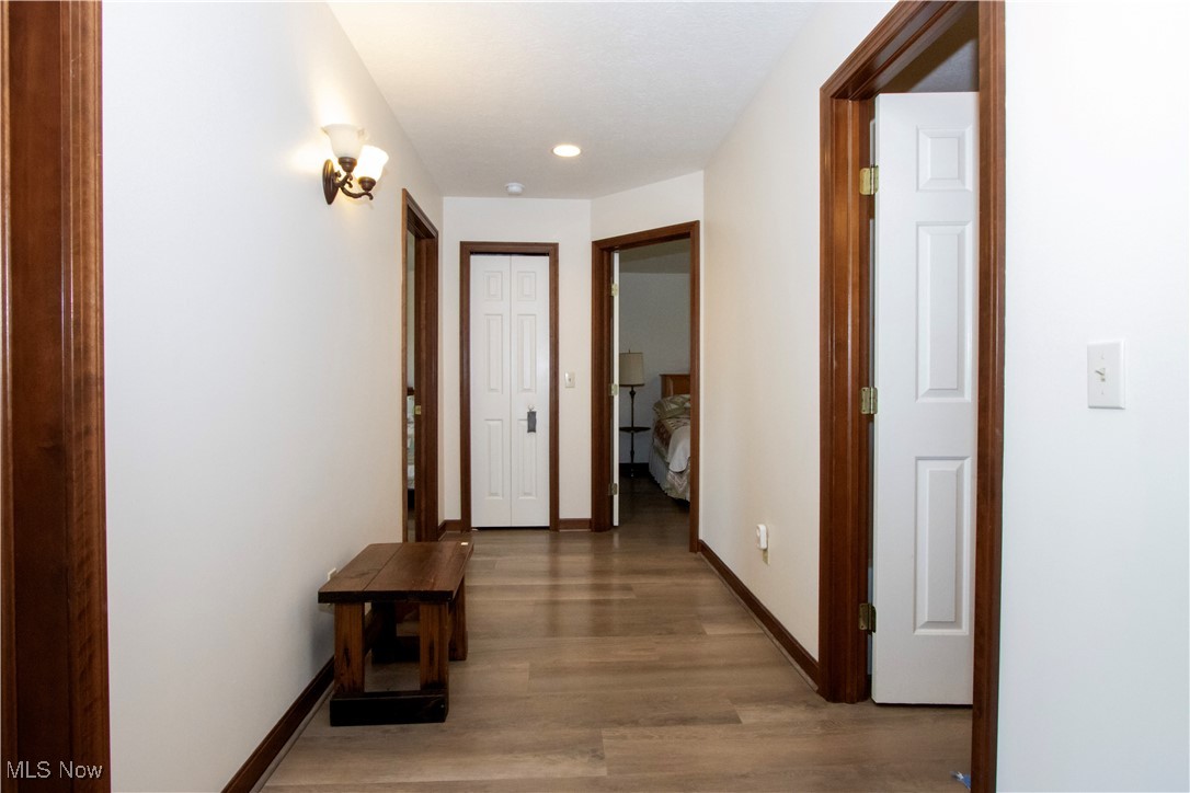 11079 Colwill Road Gambier, OH 43022 - Photo 34 of 41 Hallway featuring light wood-style floors, baseboards, and recessed lighting