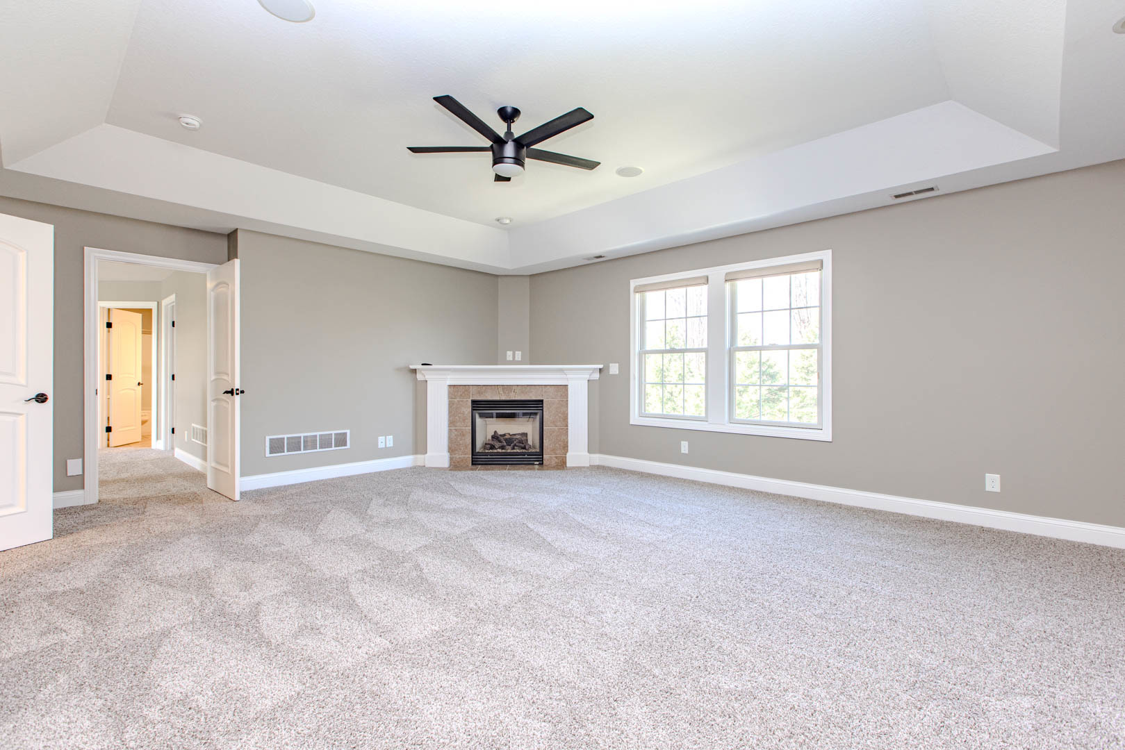 59 Stonebrook Court Bloomington, IL 61704 - Photo 23 of 52 an empty room with ceiling fan and windows