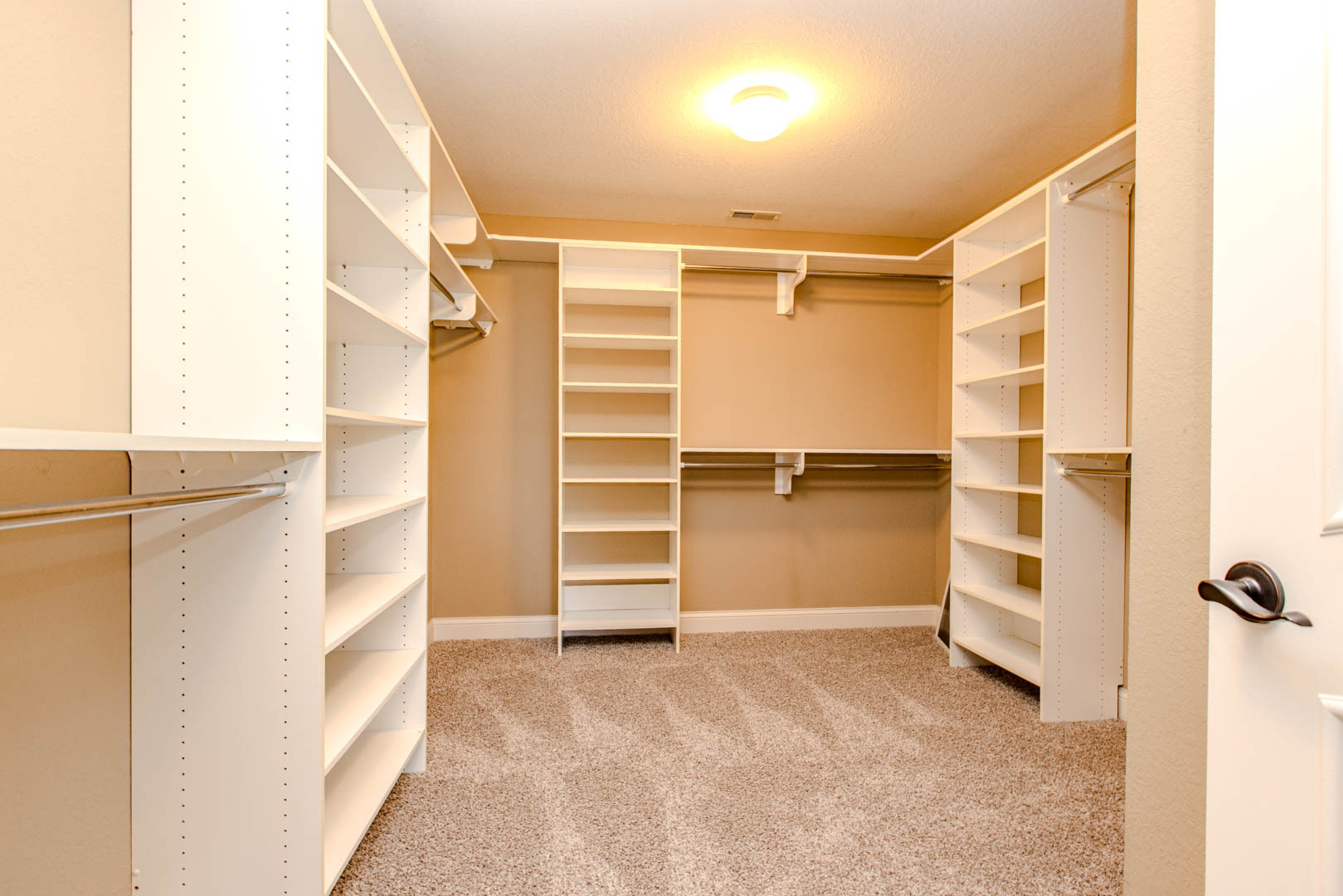 59 Stonebrook Court Bloomington, IL 61704 - Photo 24 of 52 a view of walk in closet with empty racks