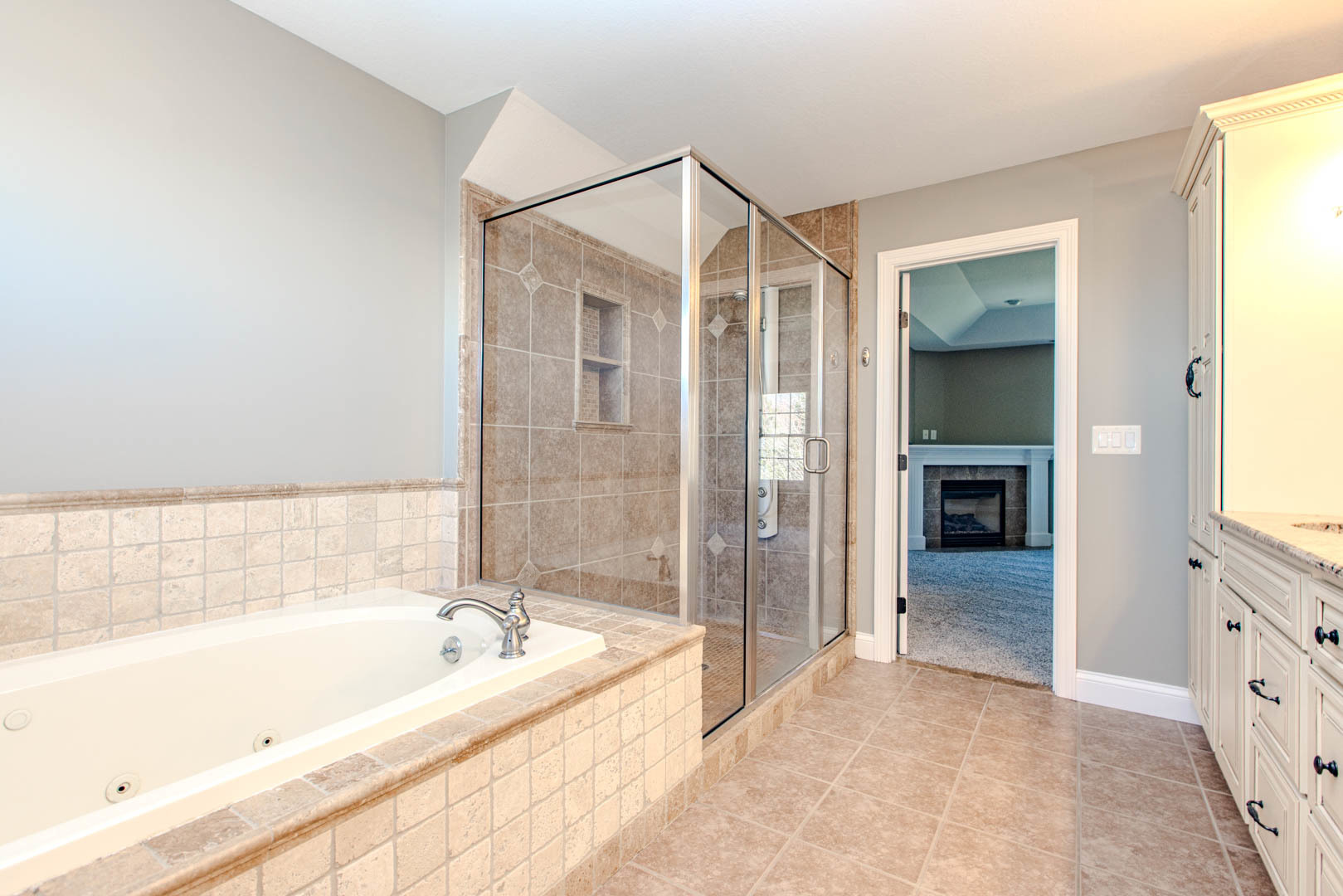 59 Stonebrook Court Bloomington, IL 61704 - Photo 26 of 52 a bathroom with a bathtub and a shower