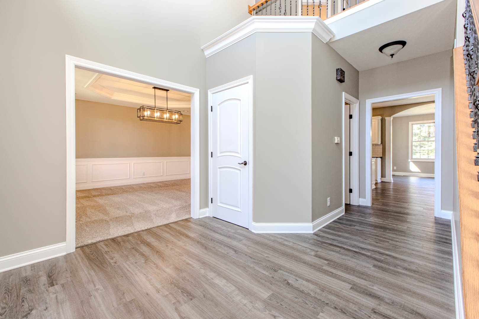 59 Stonebrook Court Bloomington, IL 61704 - Photo 3 of 52 a view of a hallway with wooden floor and a bathroom
