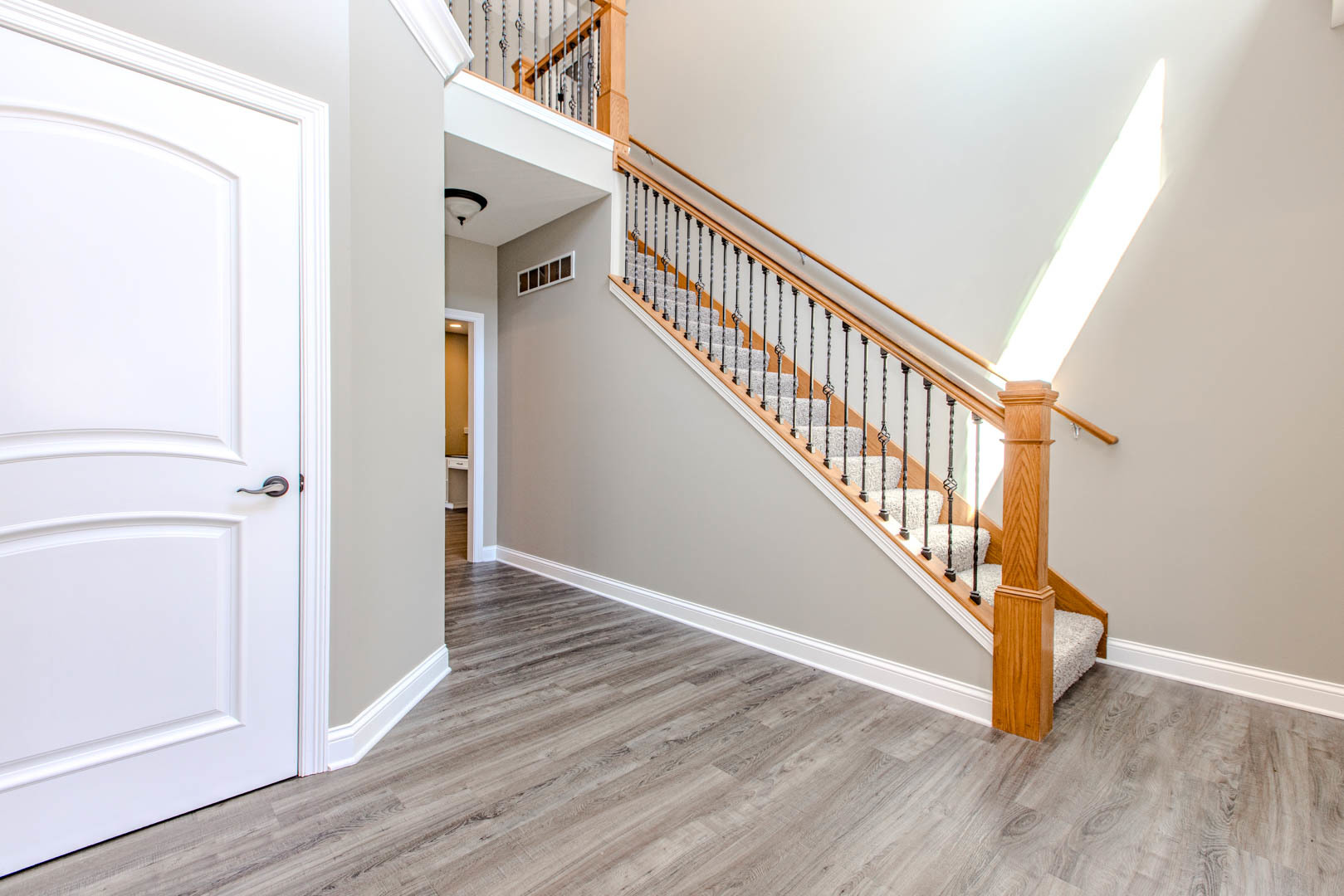 59 Stonebrook Court Bloomington, IL 61704 - Photo 4 of 52 a view of an entryway with wooden floor