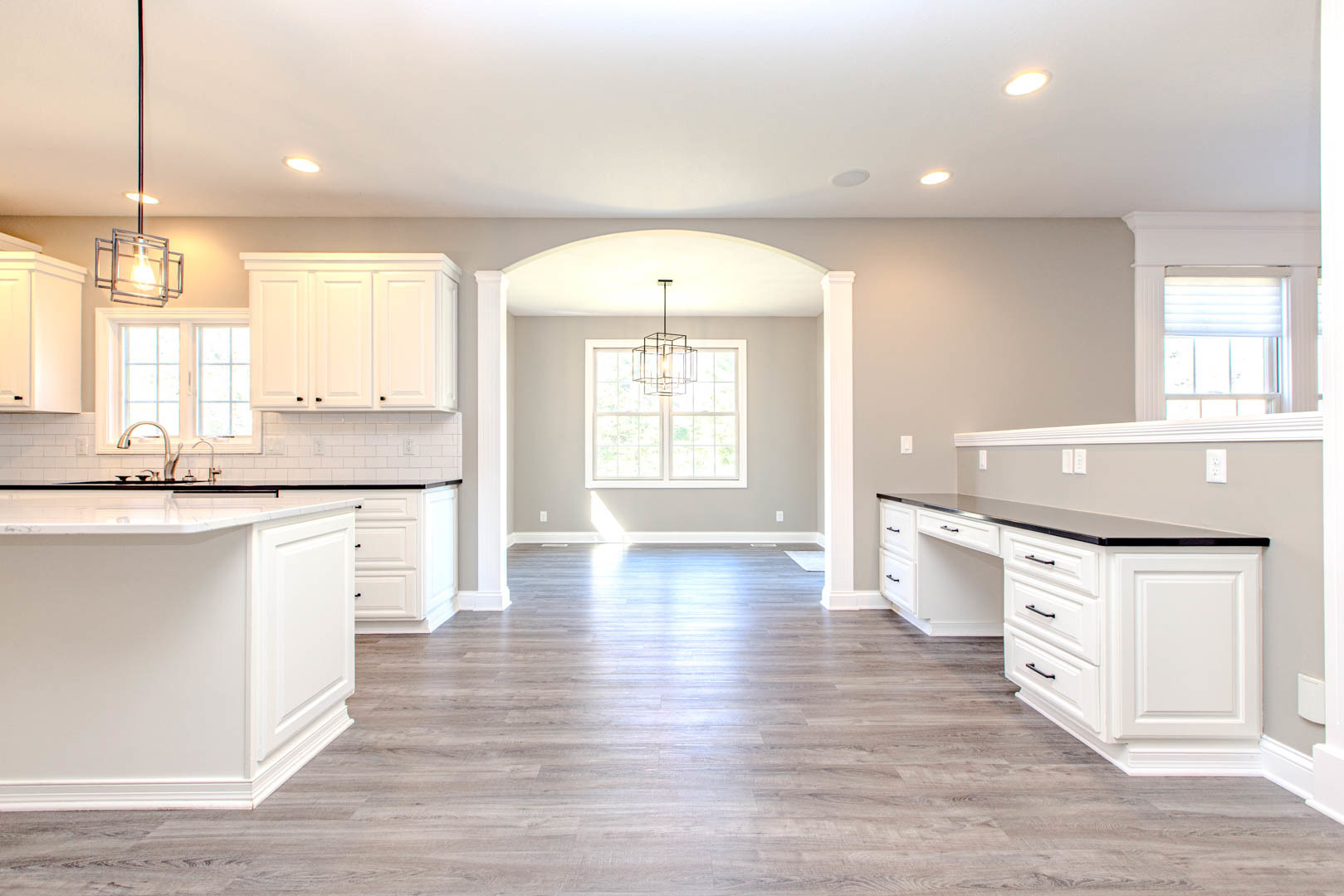 59 Stonebrook Court Bloomington, IL 61704 - Photo 9 of 52 a large kitchen with granite countertop a stove a sink a dining table and chairs