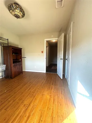 a gym area with furniture and a flat screen tv