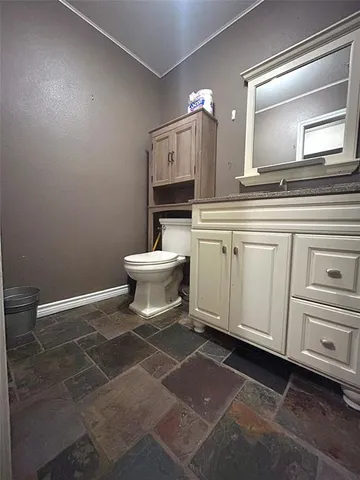 a view of a road with a house in background