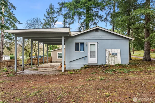 a house with trees in the background