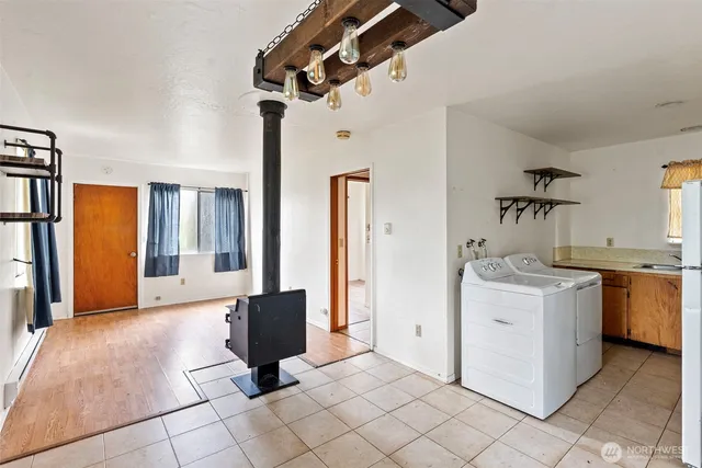 a living room with a couch and a stove top oven
