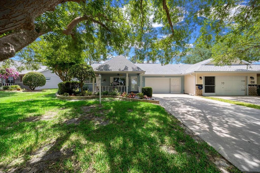 8720 Southwest 90th Street, Unit A Ocala, FL 34481 - Photo 1 of 71 a front view of a house with yard and green space