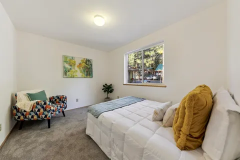 a bathroom with a toilet a sink and a mirror