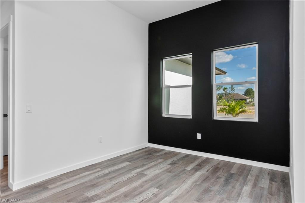 1515 Nelson Road North Cape Coral, FL 33993 - Photo 18 of 38 a view of an empty room and window