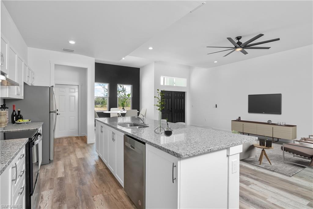 1515 Nelson Road North Cape Coral, FL 33993 - Photo 38 of 38 a view of a kitchen counter space and a sink