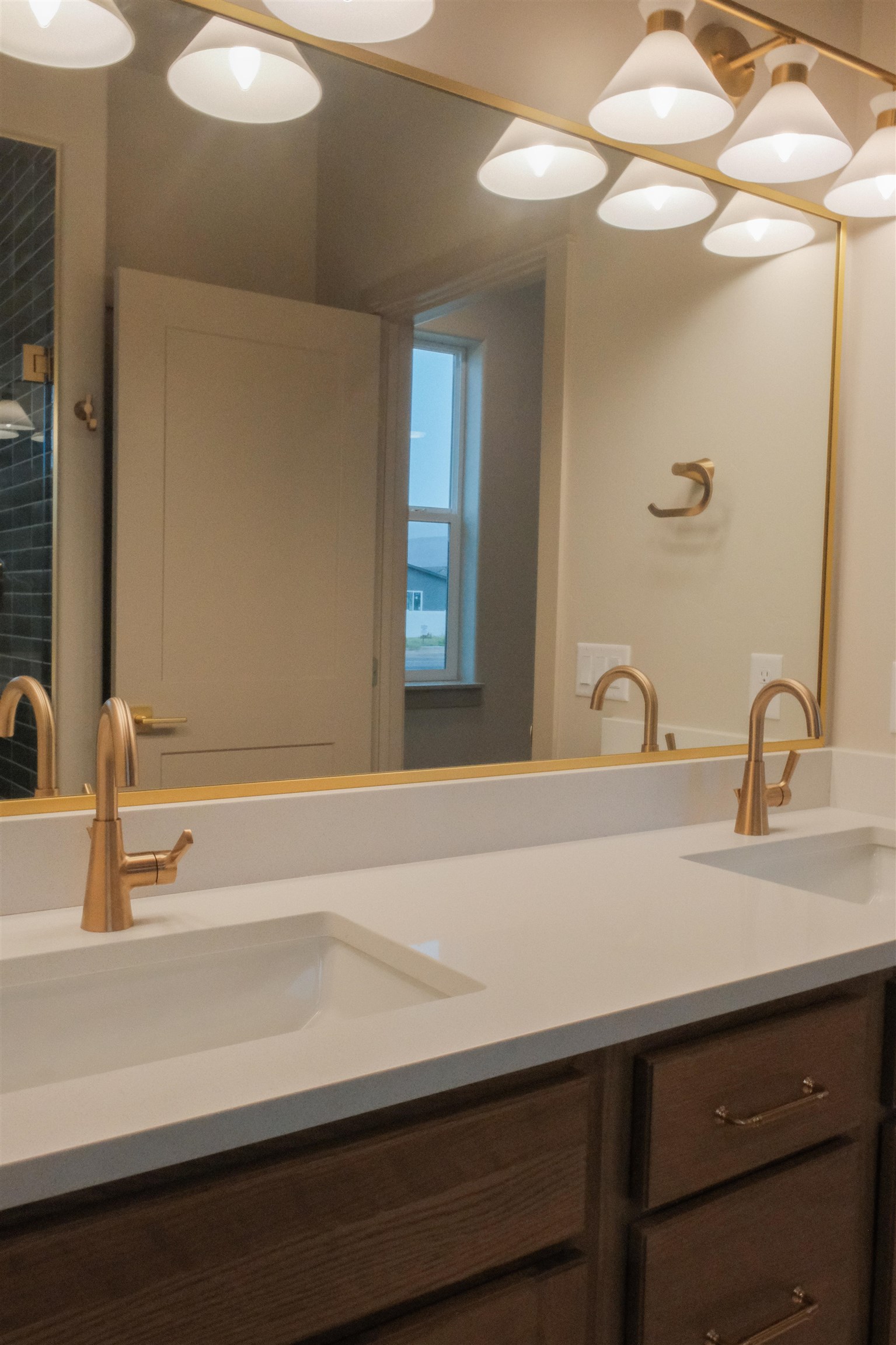 961 Urique Lane Fruita, CO 81521 - Photo 17 of 24 a bathroom with a sink and a mirror