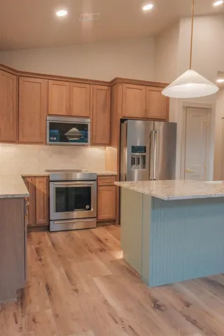 a kitchen with a stove and a microwave