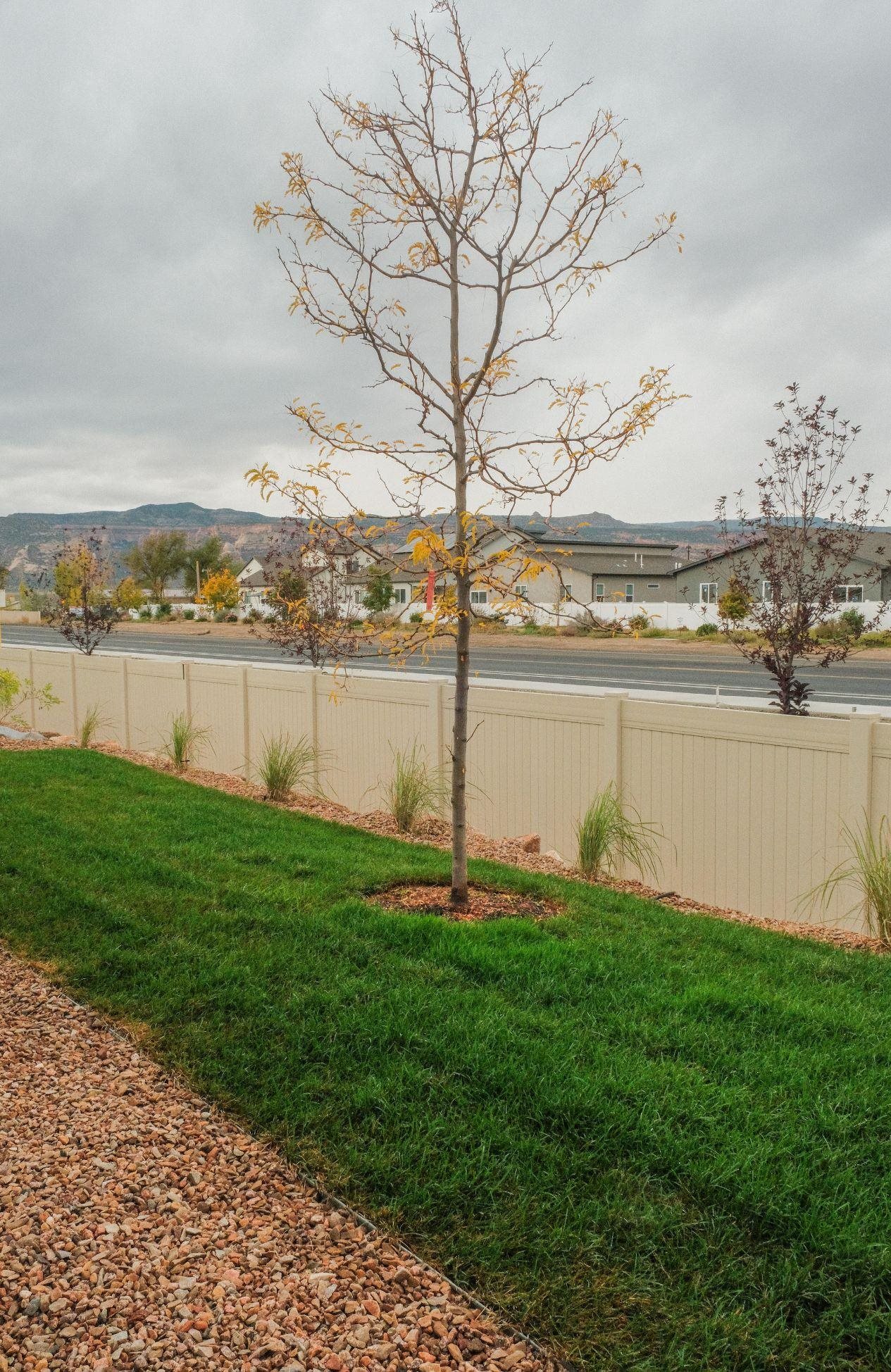 961 Urique Lane Fruita, CO 81521 - Photo 23 of 24 a view of a lake with a big yard