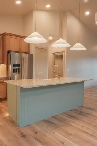 a kitchen with a refrigerator and microwave