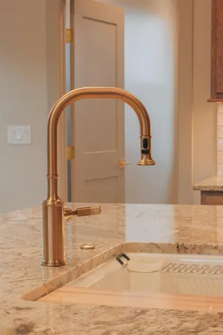 a close view of a sink and a stove