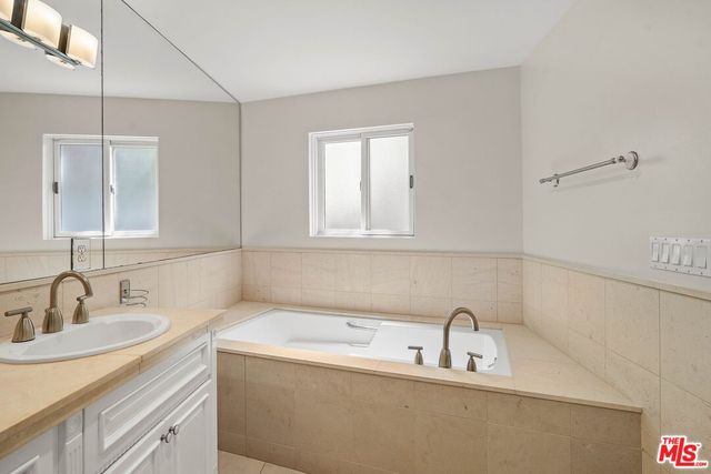 a bathroom with a sink and a bathtub