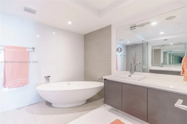 a bathroom with a bathtub and a sink