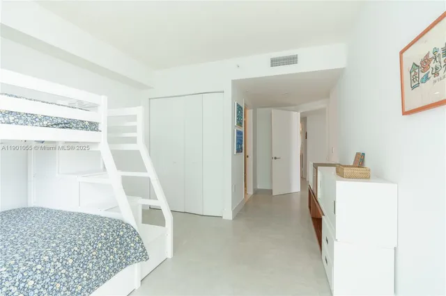 a view of front door with hallway and stairs