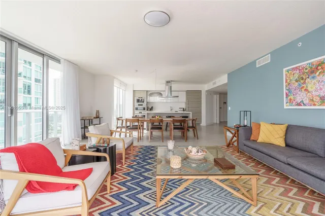 a living room with furniture and a rug