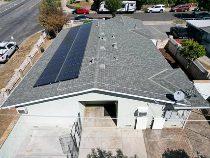 a view of a patio with table and chairs potted plants