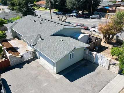 an aerial view of a house with outdoor space