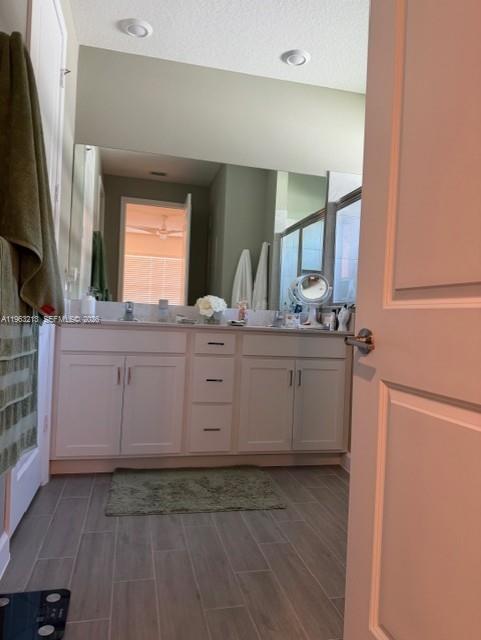 797 Bloomfield Road Port St. Lucie, FL 34984 - Photo 11 of 35 a kitchen with a sink stove and cabinets