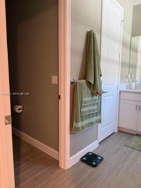 797 Bloomfield Road Port St. Lucie, FL 34984 - Photo 12 of 35 a view of a walk in closet and bathroom