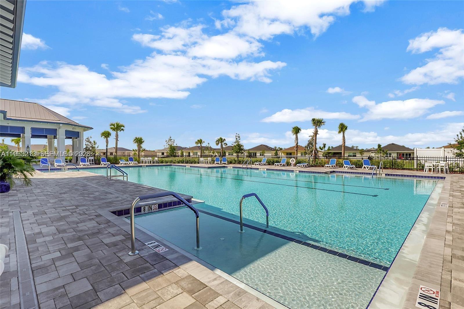 797 Bloomfield Road Port St. Lucie, FL 34984 - Photo 30 of 35 a view of a lake with a terrace