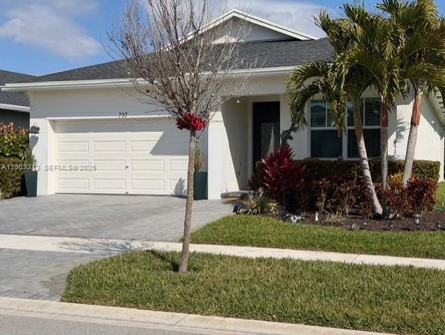 797 Bloomfield Road Port St. Lucie, FL 34984 - Photo 33 of 35 a front view of a house with garden