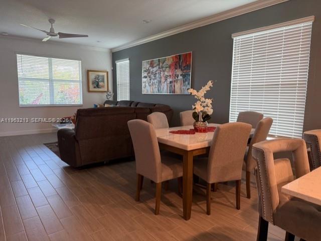 797 Bloomfield Road Port St. Lucie, FL 34984 - Photo 8 of 35 a dining room with furniture a window and wooden floor