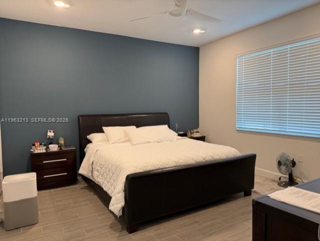 797 Bloomfield Road Port St. Lucie, FL 34984 - Photo 10 of 35 a bedroom with a bed and window