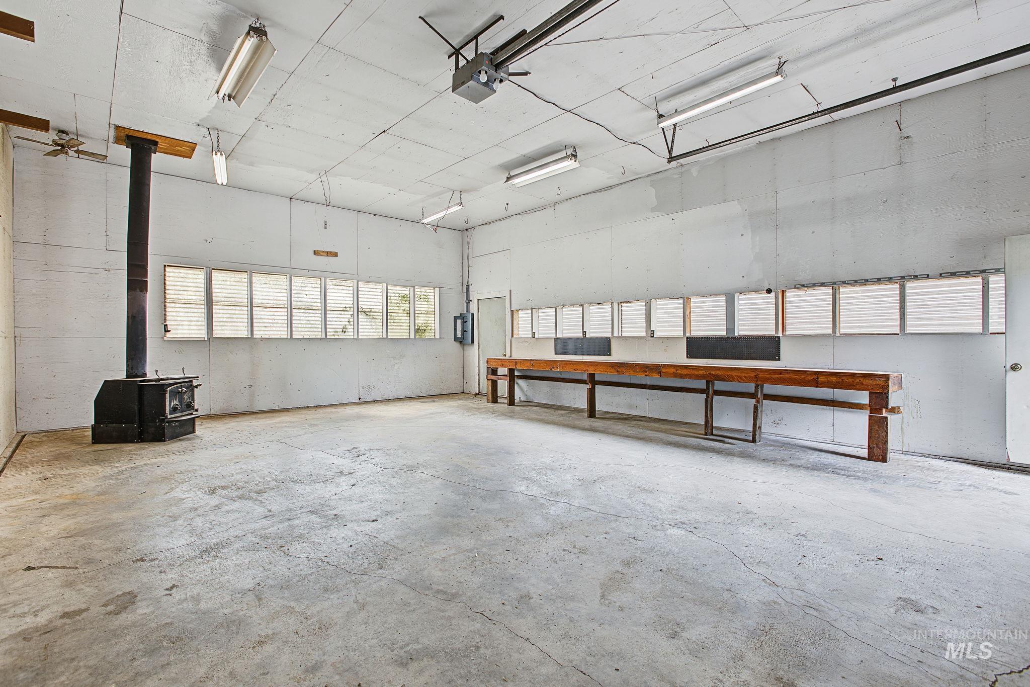 2926 Wells Bench Road Orofino, ID 83544 - Photo 35 of 48 Concrete flooring with an integrated wood-burning stove