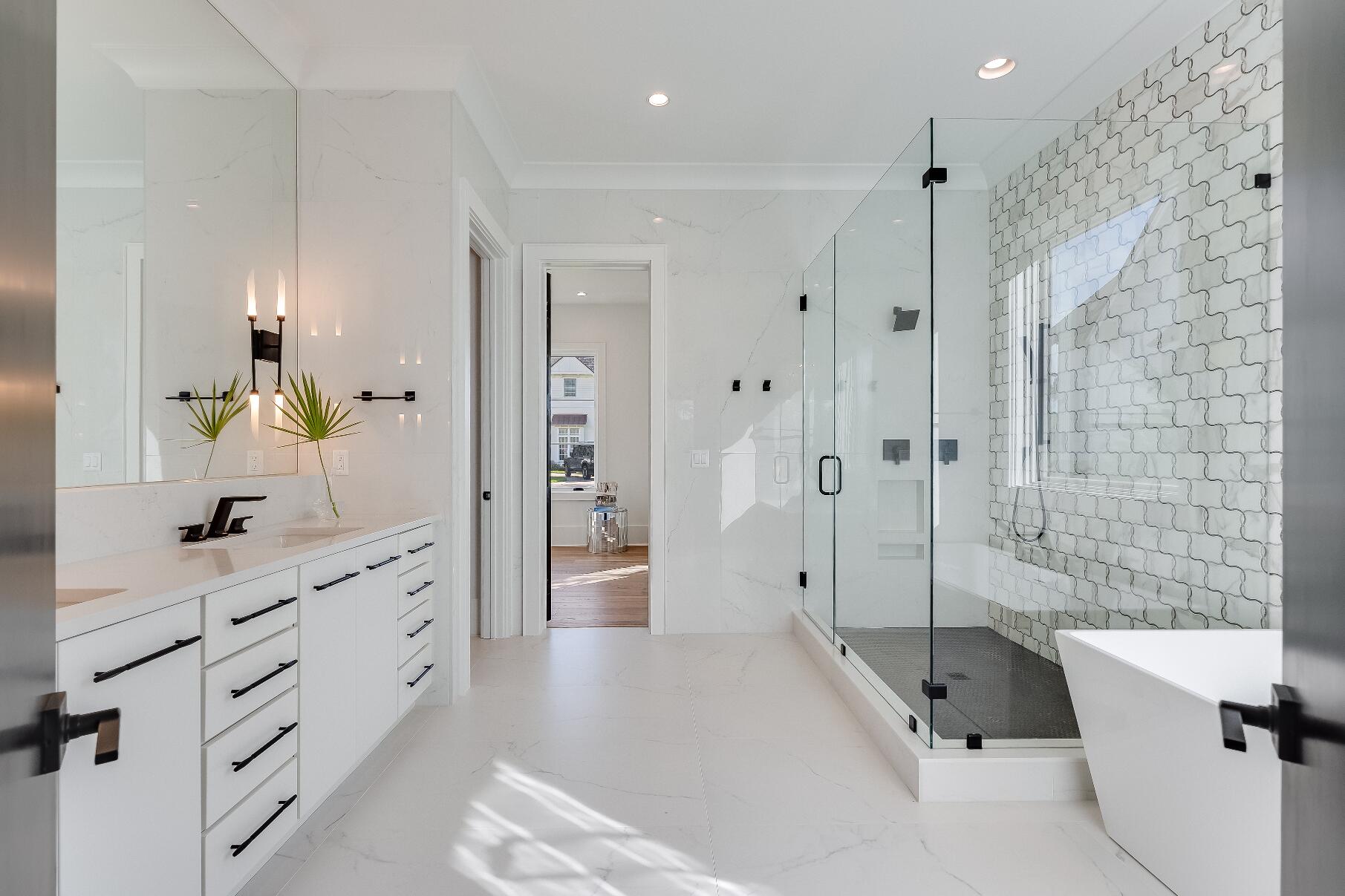 83 Norman Ct Inlet Beach Inlet Beach, FL 32461 - Photo 15 of 21 a spacious bathroom with a double vanity sink toilet and shower