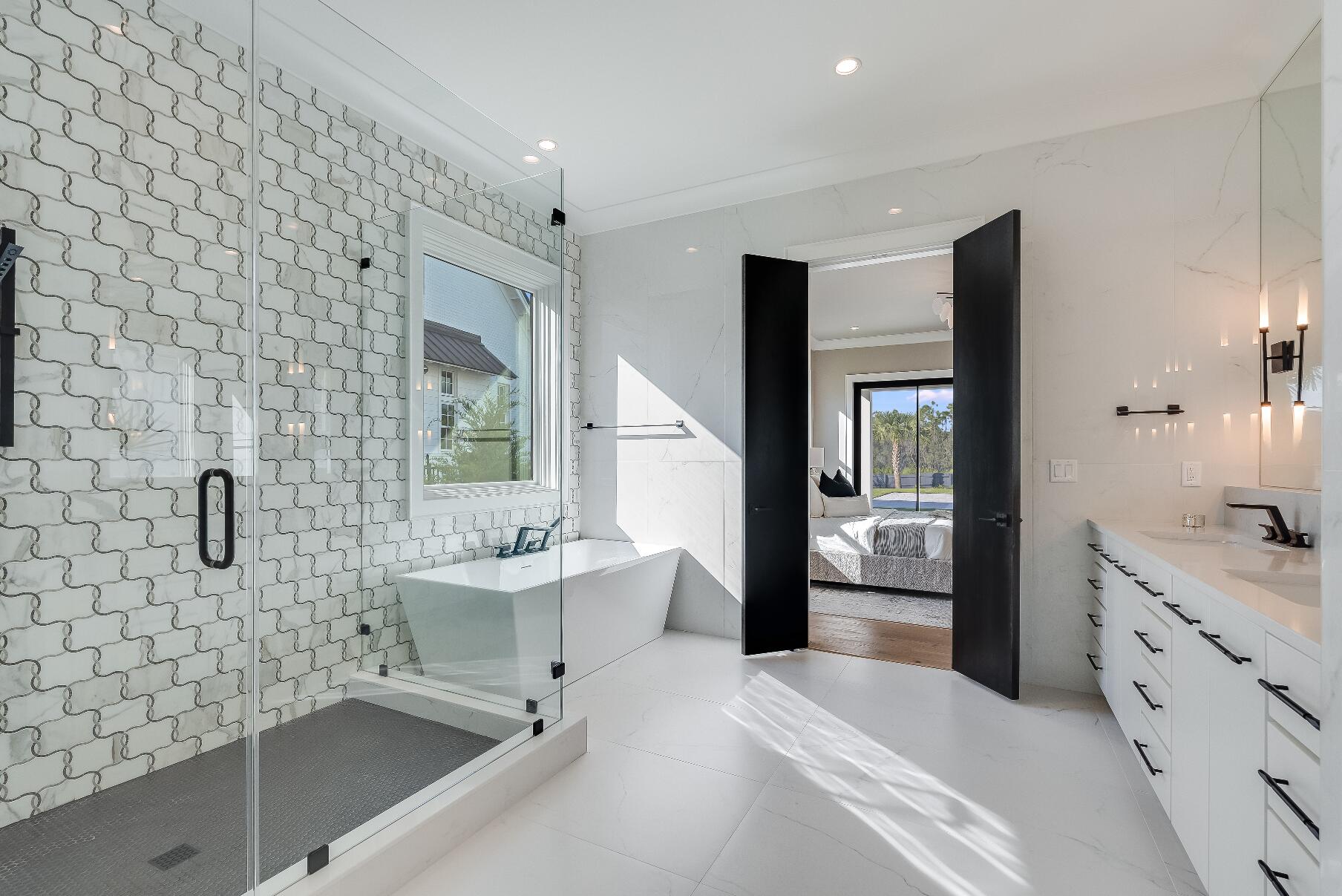 83 Norman Ct Inlet Beach Inlet Beach, FL 32461 - Photo 16 of 21 a spacious bathroom with a bathtub sink and mirror