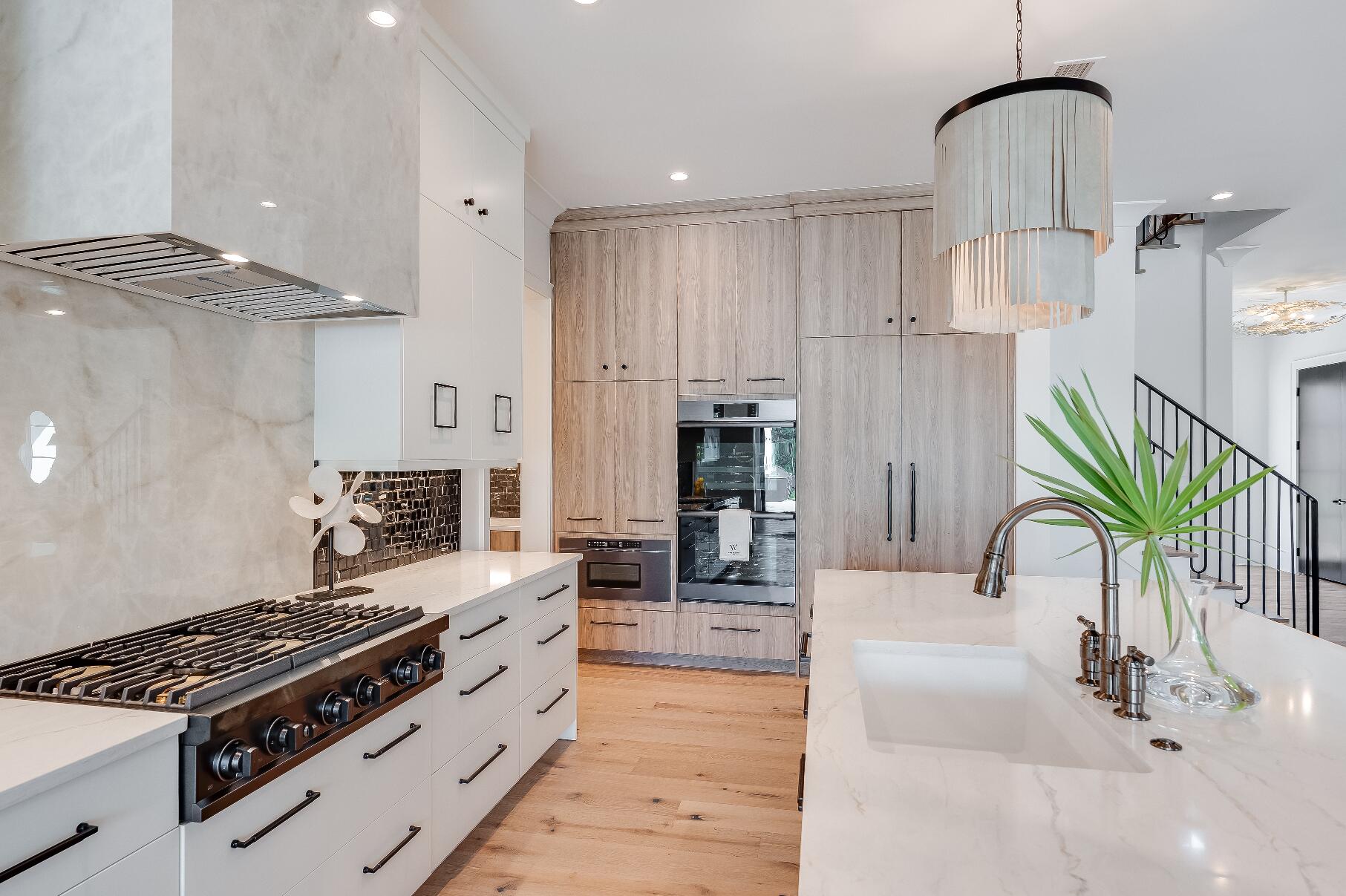 83 Norman Ct Inlet Beach Inlet Beach, FL 32461 - Photo 9 of 21 a kitchen with stainless steel appliances kitchen island a stove and a sink