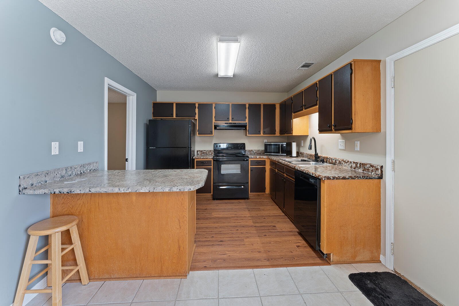 109 Nicole Lane Crestview, FL 32539 - Photo 21 of 60 a large kitchen with stainless steel appliances granite countertop a stove a sink dishwasher and a refrigerator