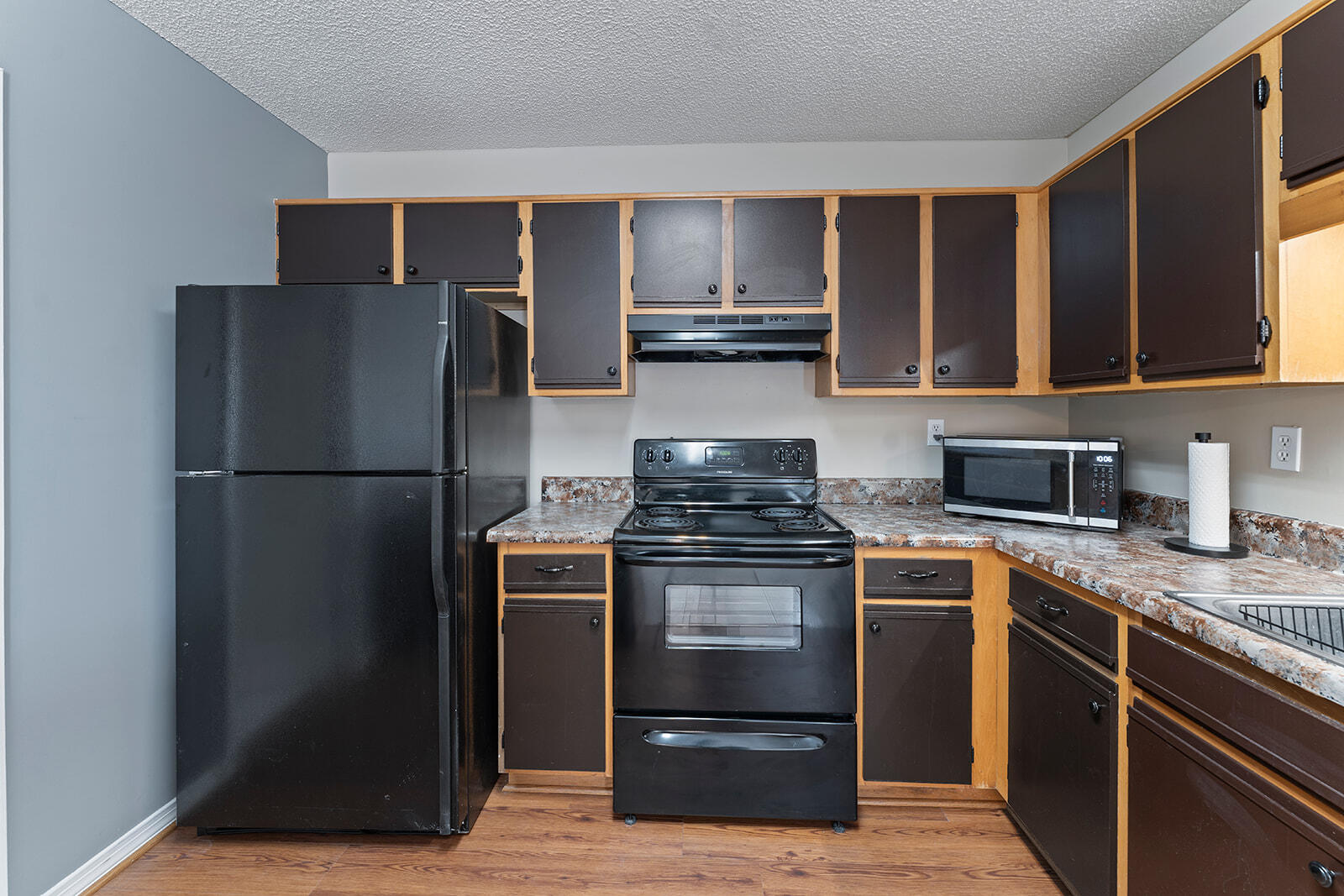 109 Nicole Lane Crestview, FL 32539 - Photo 24 of 60 a kitchen with a stove refrigerator and microwave