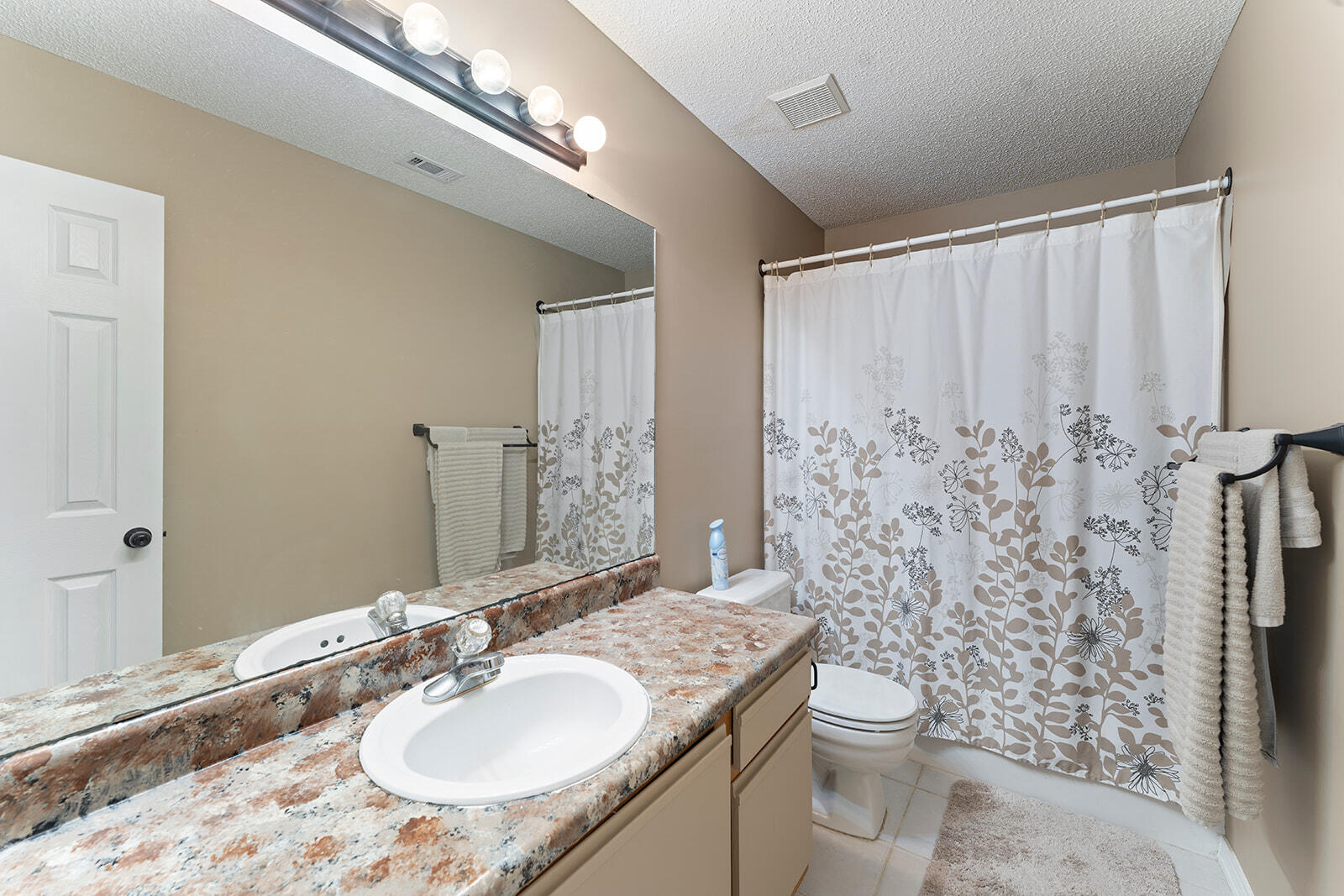 109 Nicole Lane Crestview, FL 32539 - Photo 29 of 60 a bathroom with a granite countertop sink toilet and shower