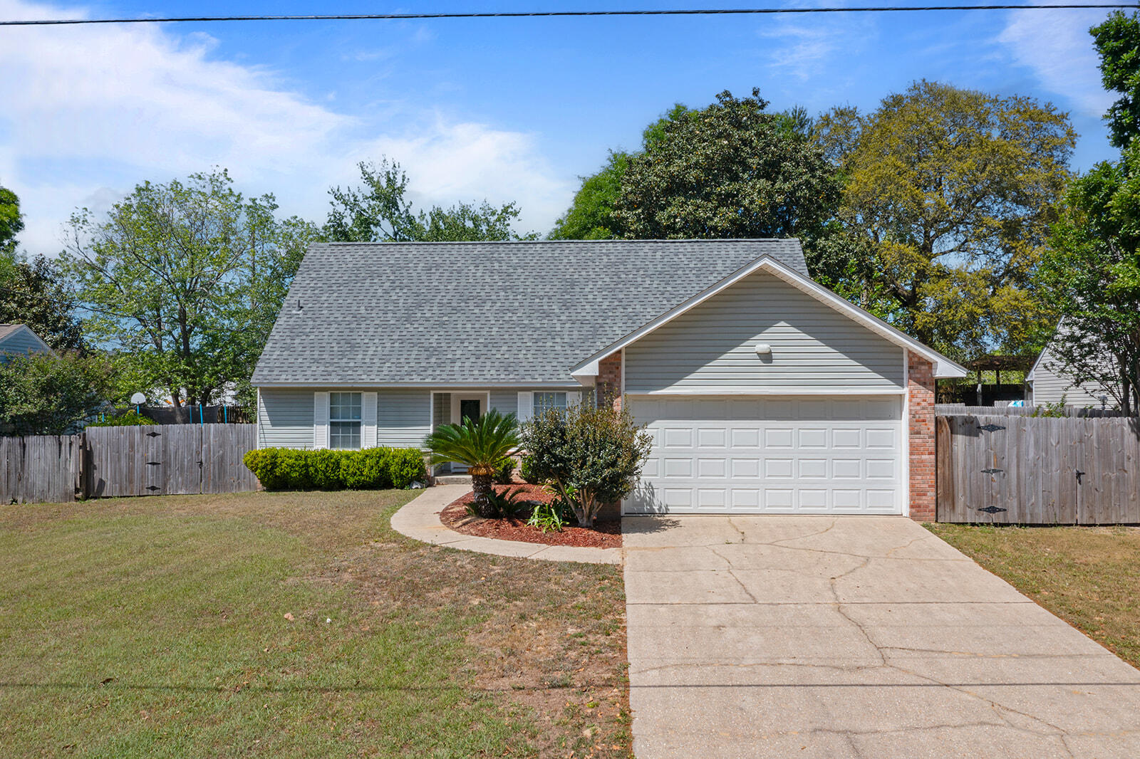 109 Nicole Lane Crestview, FL 32539 - Photo 6 of 60 a front view of a house with a yard and garage