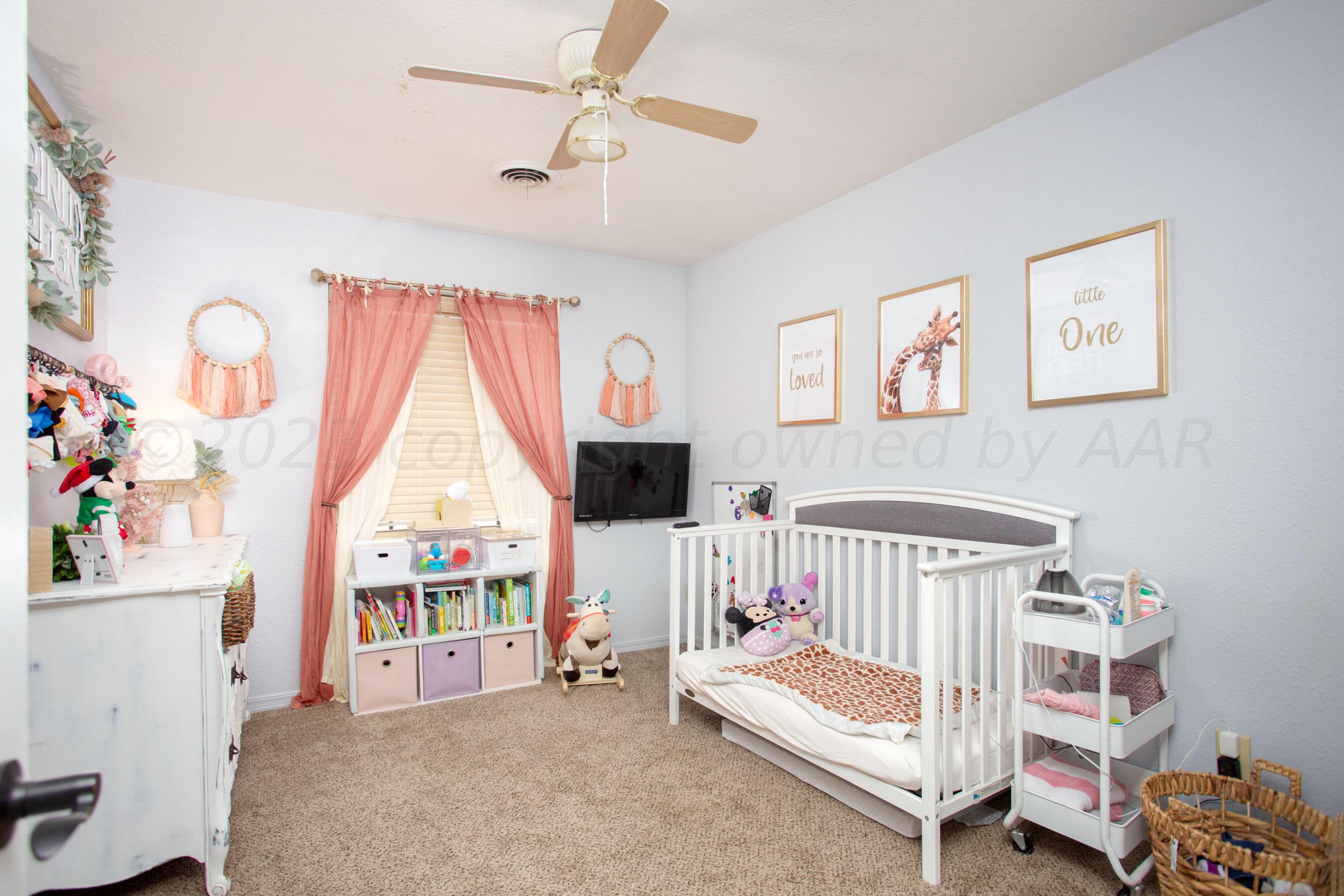 6101 Rutgers Street Amarillo, TX 79109 - Photo 13 of 24 a bedroom with furniture and a window