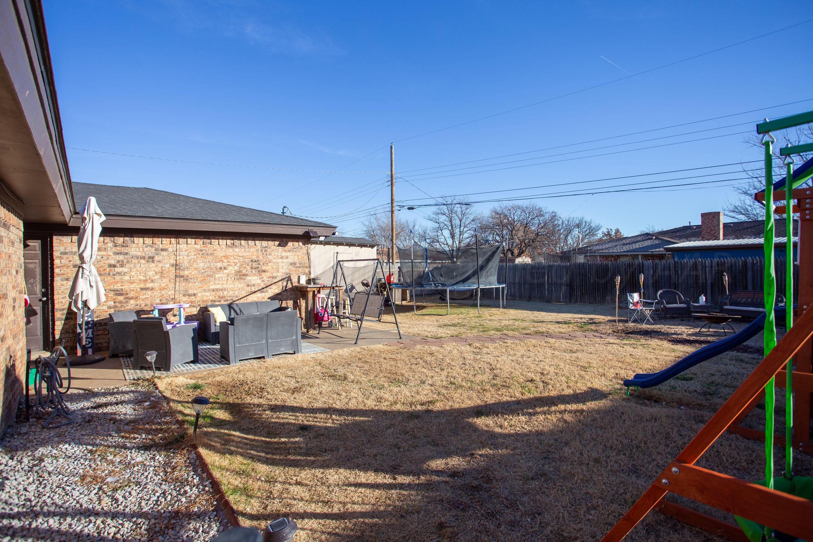 6101 Rutgers Street Amarillo, TX 79109 - Photo 17 of 24 a view of a swimming pool with a patio