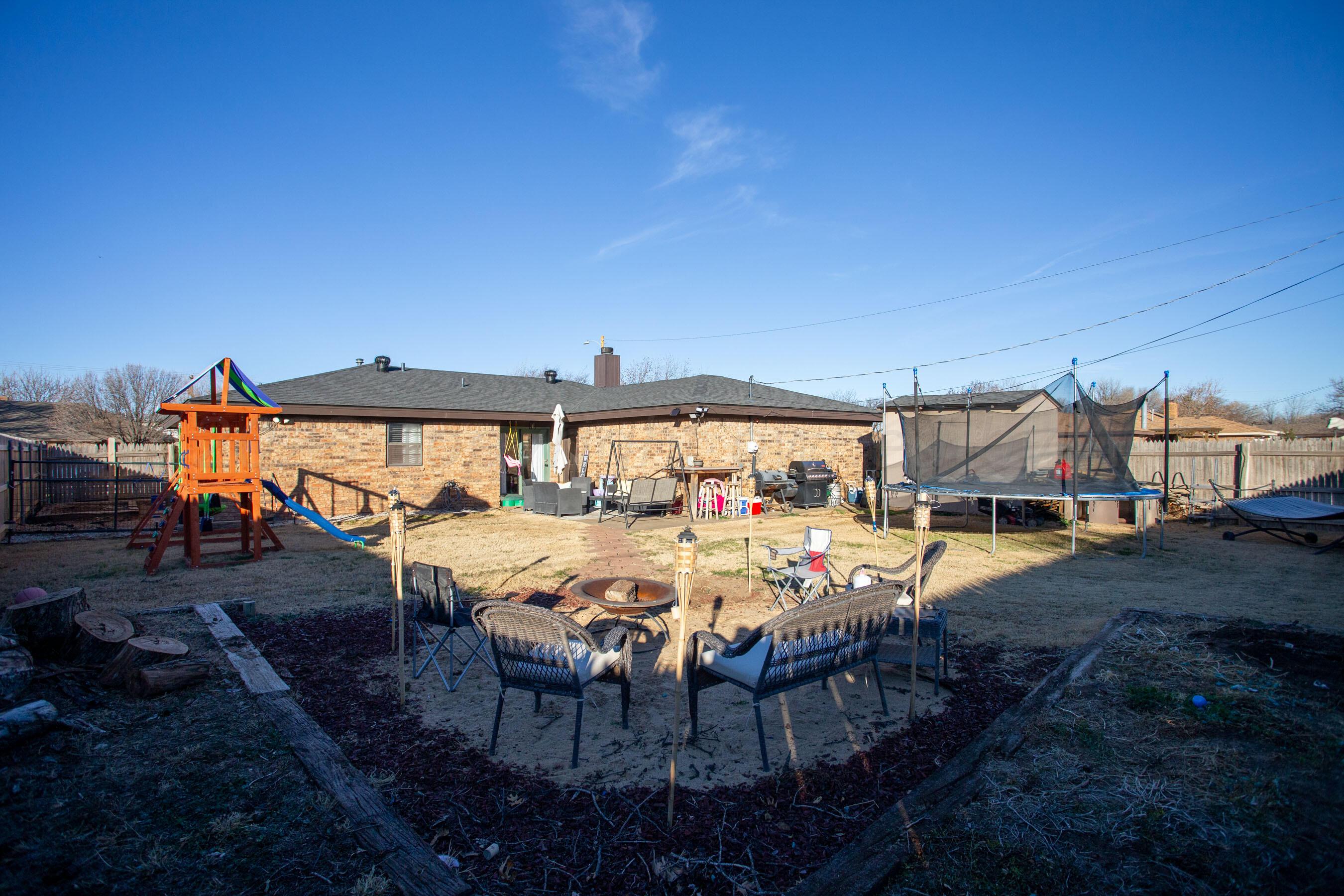 6101 Rutgers Street Amarillo, TX 79109 - Photo 20 of 24 a view of a patio with table and chairs