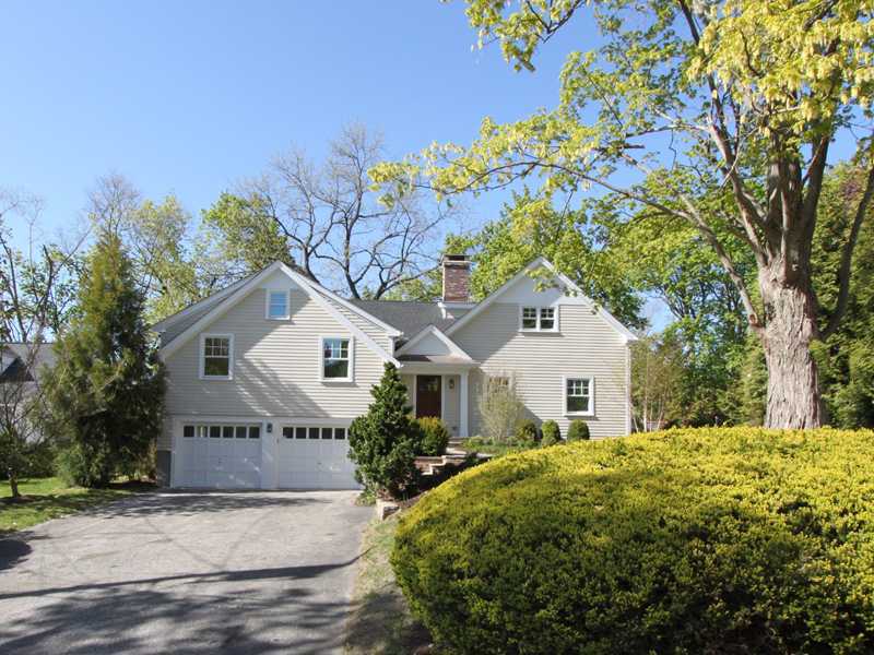11 Bayside Terrace Riverside, CT 06878 - Photo 1 of 12 a front view of a house with a garden