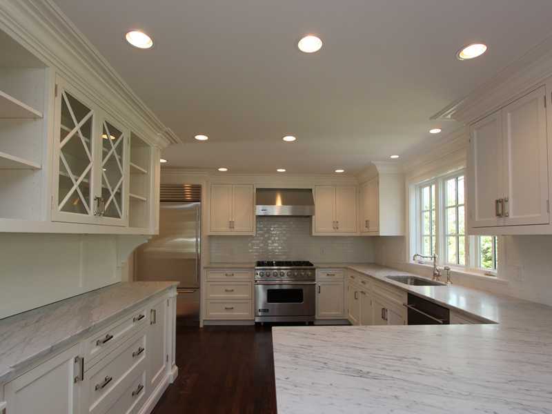 11 Bayside Terrace Riverside, CT 06878 - Photo 3 of 12 a large kitchen with stainless steel appliances granite countertop a sink and a stove
