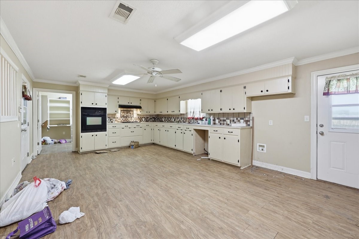150 Gary Street Bridge City, TX 77611 - Photo 4 of 12 Kitchen area with ample cabinetry and open layout design.