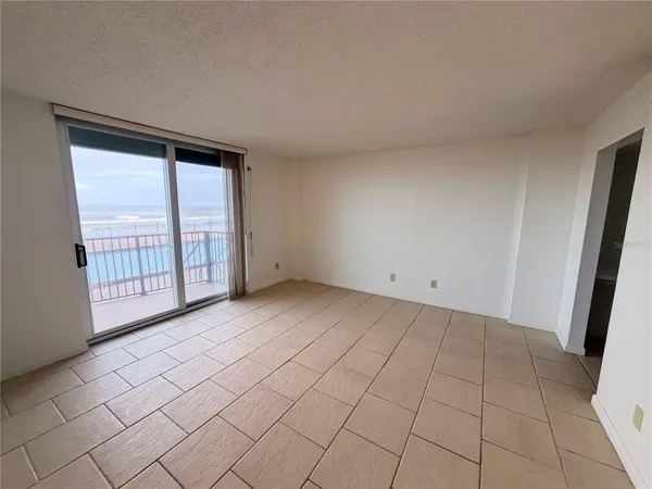 a view of an empty room and window