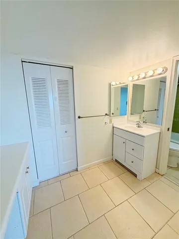 a bathroom with a sink a mirror and a shower