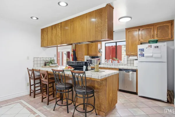 a kitchen with stainless steel appliances granite countertop a sink and a cabinets